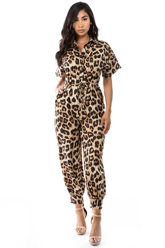 Embrace your wild side in style with this stunning Leopard Print Jumpsuit. The sexy button-front design adds a touch of sophistication, while the all-over leopard prCoeur de la Mode