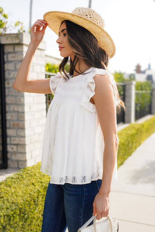 Feminine ruffled trim adds a playful touch to this tank topDelicate lace detail enhances the overall charm of this flowy topThe comfortable and relaxed fit of this tCoeur de la Mode