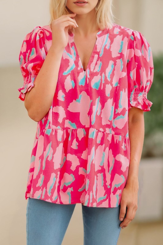 The chic printed design will be your new favoriteThis is a casual blouse for women finished with a ruffle hemIt has a split neckline, frilly short bubble sleeves, anCoeur de la Mode