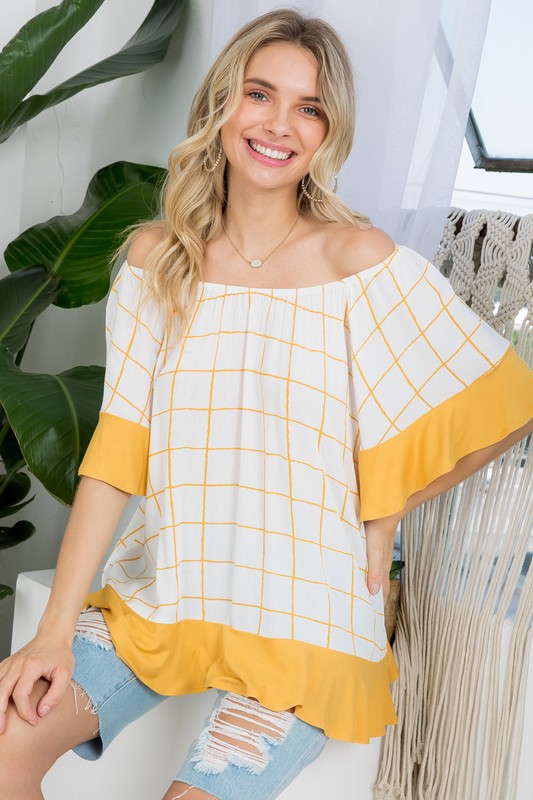 PLUS WOVEN PLAID AND SOLID JERSEY MIX RUFFLE PEASANT TOP- Plus Plaid mix ruffle peasant top- Short ruffled bell sleeves- Wear it off shoulder or as a loose scoop necCoeur de la Mode