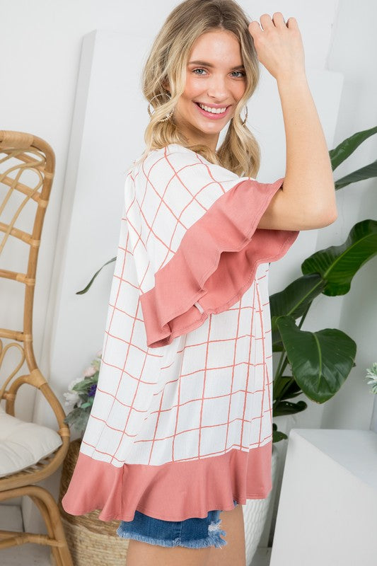 PLUS WOVEN PLAID AND SOLID JERSEY MIX RUFFLE PEASANT TOP- Plus Plaid mix ruffle peasant top- Short ruffled bell sleeves- Wear it off shoulder or as a loose scoop necCoeur de la Mode