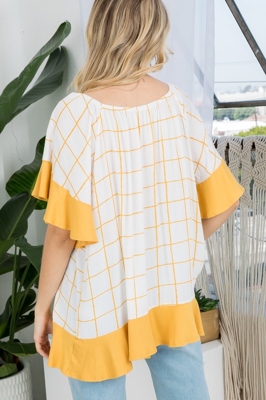 PLUS WOVEN PLAID AND SOLID JERSEY MIX RUFFLE PEASANT TOP- Plus Plaid mix ruffle peasant top- Short ruffled bell sleeves- Wear it off shoulder or as a loose scoop necCoeur de la Mode