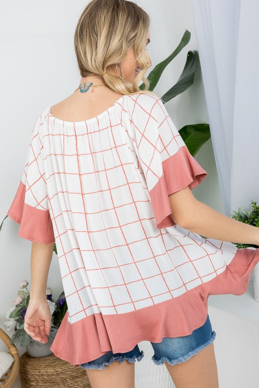 PLUS WOVEN PLAID AND SOLID JERSEY MIX RUFFLE PEASANT TOP- Plus Plaid mix ruffle peasant top- Short ruffled bell sleeves- Wear it off shoulder or as a loose scoop necCoeur de la Mode