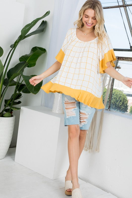 PLUS WOVEN PLAID AND SOLID JERSEY MIX RUFFLE PEASANT TOP- Plus Plaid mix ruffle peasant top- Short ruffled bell sleeves- Wear it off shoulder or as a loose scoop necCoeur de la Mode