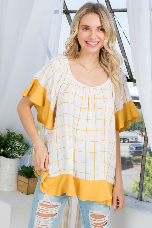 PLUS WOVEN PLAID AND SOLID JERSEY MIX RUFFLE PEASANT TOP- Plus Plaid mix ruffle peasant top- Short ruffled bell sleeves- Wear it off shoulder or as a loose scoop necCoeur de la Mode